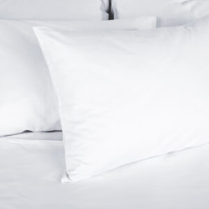 2 Pillows white on a bed copy